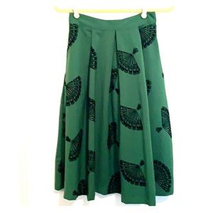Green past knee pleated skirt